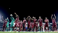 Qatar players acknowledge their fans after defeating Iran on Thursday.