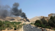 Photo used for representational purposes. Smoke billows for the second day from the Shahran oil depot, northwest of Tehran, on June 16, 2025. Photo by AFP.
