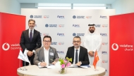 Chief Operating Officer at Vodafone Qatar, Baran Yurdagul; and CEO of The View Hospital Dr. Fatih Mehmet Gul signing the MoU. 