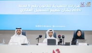 Assistant Undersecretary for Real Estate Registration and Documentation Affairs at the Ministry of Justice Amer Saed Ali Al Ghafri with other officials during the event.