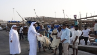MECC officials distributing eco-friendly bags to fishermen during an awareness campaign to curb the use of plastic bags. 