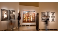Visitors view some of the artworks on display at the exhibition.