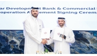 Chief Wholesale and International Banking Officer of Commercial Bank, Fahad Badar, EGM with Executive Director of SME Development at QDB, Dr. Hamad Salem Mejegheer.