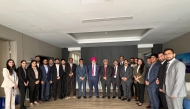 ICAI leadership delegation pose with KPMG staff.