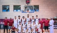Qatar Reserve Team players and officials pose for a photograph.