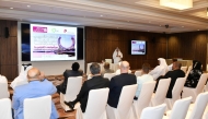 Participants listening to a presentation during the training forum. 