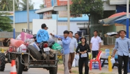  Cambodian villagers from Oddar Meanchey province receive drinking water after fleeing their homes to seek refuge in Siem Reap province, Cambodia, July 25, 2025.  (Photo by Sao Khuth/Xinhua)

