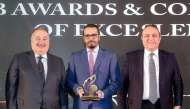 Chief of Corporate Sector at QIIB Omar Abdulaziz Al Meer with other officials receiving the award during the ceremony.w