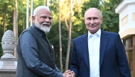 File: In this pool photograph distributed by the Russian state agency Sputnik, Russia's President Vladimir Putin welcomes Indian Prime Minister Narendra Modi for an informal meeting at the Novo-Ogaryovo state residence, outside Moscow, on July 8, 2024. (Photo by Sergei Bobylyov / POOL / AFP)

