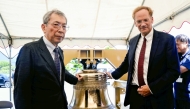 Kojiro Moriuchi, left, and James L Nolan Jr are seen beside a new bell at Urakami Cathedral in Nagasaki on July 17. (The Japan News)
