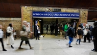 Pedestrians pass one of the closed entrances to London Bridge Underground Station in London on September 8, 2025. (Photo by Carlos Jasso / AFP)
