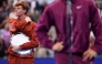 Jannik Sinner of Italy looks on as Carlos Alcaraz of Spain speaks following their Men's Singles Final match on Day Fifteen of the 2025 US Open at USTA Billie Jean King National Tennis Center on September 07, 2025 in New York City. Clive Brunskill/Getty Images/AFP