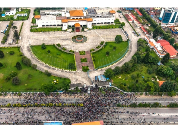 An aerial view shows demonstrators gathered outside Nepal's Parliament (top) during a protest in Kathmandu on September 8, 2025. (Photo by Prabin Ranabhat / AFP)