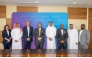 QTerminals and GAC officials pose for a group photo during the agreement signing.