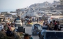 Palestinians transport their belongings as they evacuate Gaza City towards southern areas of the coastal Gaza Strip, on September 10, 2025. (Photo by Eyad Baba / AFP)