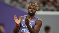 US sprinter Noah Lyles celebrates after competing in the men's 100m heats during the World Athletics Championships in Tokyo on September 13, 2025. (Photo by Andrej ISAKOVIC / AFP)