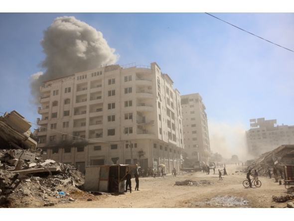 Smoke billows after an Israeli strike on a building in Gaza City's Tal al-Hawa district on September 13, 2025. (Photo by Omar AL-QATTAA / AFP)
