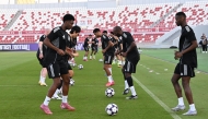 Al Gharafa players take part in a training session in Sharjah yesterday.