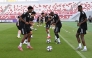 Al Gharafa players take part in a training session in Sharjah yesterday.