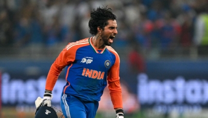 India's Tilak Varma celebrates their victory at the end of the Asia Cup 2025 Twenty20 international cricket final match between India and Pakistan at the Dubai International Stadium in Dubai on September 28, 2025. (Photo by Sajjad Hussain / AFP)