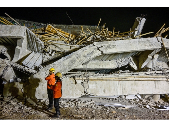 Rescue personnel inspect the site after a building collapsed at an Islamic boarding school in Sidoarjo, East Java province on September 29, 2025, injuring a number of students and trapping several others under the rubble. Photo by Juni KRISWANTO / AFP