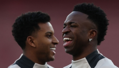 File: Real Madrid's Brazilian forward #11 Rodrygo (left) and Real Madrid's Brazilian forward #07 Vinicius Junior take part in a training session at the Emirates stadium in London on April 7, 2025. (Photo by Adrian Dennis / AFP)