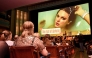 Taylor Swift fans listen to a song during a listening event for Swift's new album 'The Life of a Showgirl' at the Astor Theatre in Melbourne on October 3, 2025. Photo by William WEST / AFP