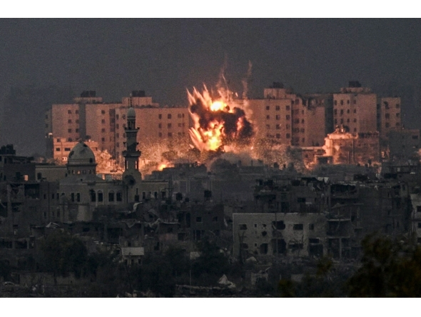 (Files) A fireball erupts during Israeli bombardment in the northern Gaza Strip on October 14, 2023. (Photo by Aris Messinis / AFP)