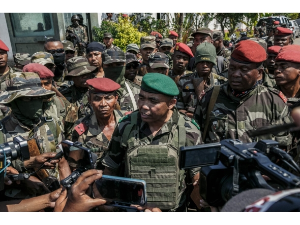 Members of a Madagascar army contingent talk to the media in a road near their camp near Antananarivo on October 11, 2025. (Photo by RIJASOLO / AFP)
