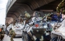 Bangladeshi soldiers disembark armored vehicles as they patrol the streets to disperse the anti-quota protesters in Dhaka on July 20, 2024. (Photo by AFP)