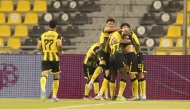 Qatar SC players celebrate with Joao Pedro after the Brazilian scored a goal against Umm Salal yesterday. 