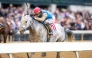 Jockey Irad Ortiz Jr, and Hit Show on their way to win the race.

