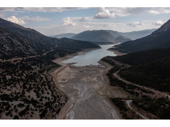 This aerial photograph shows the low water level of the Mornos artificial lake following a drought, near the village of Lidoriki, about 240 km northwest of Athens, on September 1, 2024. Photo by Angelos TZORTZINIS / AFP