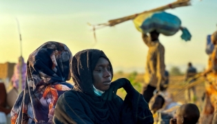 A displaced woman rests in Tawila, in the country's war-torn western Darfur region, on October 28, 2025, after fleeing El-Fasher following the city's fall to the Rapid Support Forces (RSF). (Photo by AFP)

