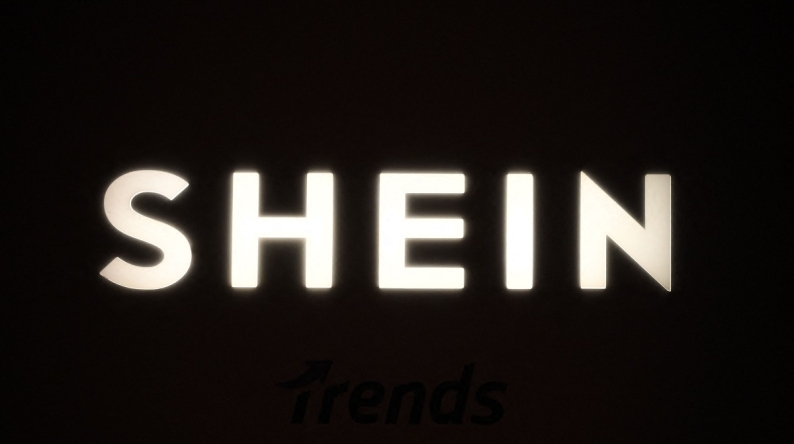 A picture shows the logo Shein during the Urban Ritual fashion show Fall-Winter 2025/26 organized by Chinese fashion giant Shein in Milan, on October 16, 2025. Photo by Piero CRUCIATTI / AFP