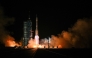 A Long March-2F carrier rocket, carrying the Shenzhou-21 spacecraft and a crew of three astronauts, lifts off from the Jiuquan Satellite Launch Centre in the Gobi desert, in northwest China on October 31, 2025. (Photo by Hector Retamal / AFP)