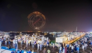 People enjoying fireworks during the opening of the Qatar Boat Show 2025.