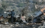 A man stands amid the debris at the site of an Israeli airstrike in the southern Lebanese village of Toura on November 6, 2025. (Photo by MAHMOUD ZAYYAT / AFP)