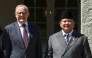 Australia's Prime Minister Anthony Albanese (L) greets Indonesia's President Prabowo Subianto at Kirribilli House in Sydney on November 12, 2025. (Photo by Hollie Adams / POOL / AFP)