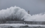 Strong waves crash against the sea wall in Yilan on November 11, 2025, as Typhoon Fung-Wong approaches. (Photo by I-Hwa Cheng / AFP)