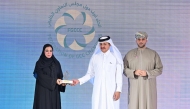 Qatar Chamber Chairman, Sheikh Khalifa bin Jassim Al Thani, Chairman of the Federation of GCC Chambers Sheikh Faisal Abdullah Al Rawas presenting memento to a QNB official during the 7th GCC Businesswomen Forum.