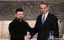 Greece's Prime Minister Kyriakos Mitsotakis (R) and Ukraine's President Volodymyr Zelensky shake hands after attending a joint press conference following their meeting in Athens, on November 16, 2025. Photo by Angelos Tzortzinis / AFP
