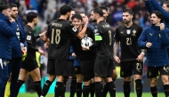 Portugal players celebrate after the 2026 World Cup qualifiers Europe zone group F football match between Portugal and Armenia, at Dragao stadium in Porto on November 16, 2025. Portugal won 9-1. (Photo by Miguel RIOPA / AFP)