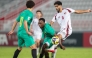 Qatar's Jassem Gaber (right) vies for the ball with Zimbabwe players.