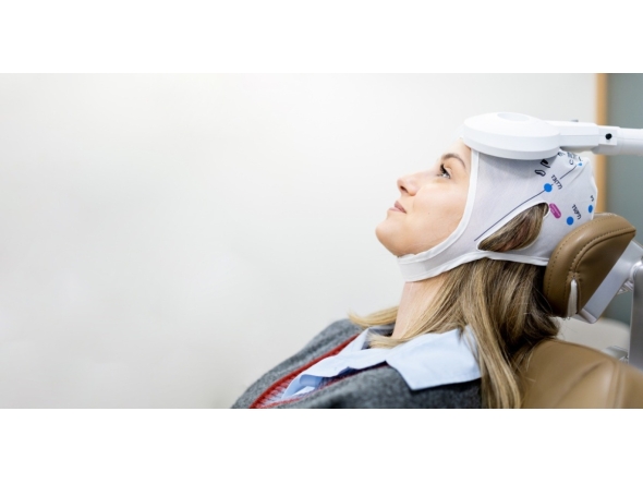 A patient receiving advanced Repetitive Transcranial Magnetic Stimulation therapy.