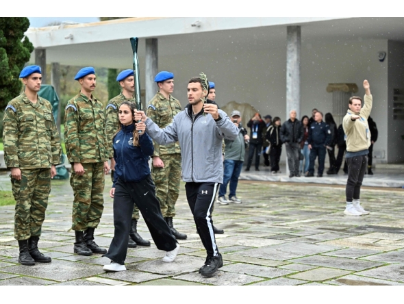 Performers take part in a rehearsal of the lighting of the Olympic flame for the Milano-Cortina 2026 Winter Olympic Games, at the Museum of Ancient Olympia, in Olympia on November 25, 2025. (Photo by Aris MESSINIS / AFP)