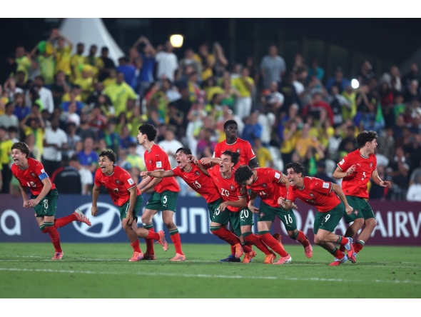 Portugal players celebrate after winning the penalty shoot out against Brazil.