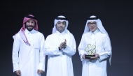 Chairman of Qatar Tourism H E Saad bin Ali Al Kharji (centre) with Akbar Al Baker (right) during the award ceremony.