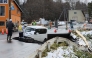 A vehicle is seen on a collapsed road in Tohoku town in Aomori Prefecture on December 9, 2025, following a 7.5 magnitude earthquake off northern Japan. (Photo by JIJI Press / AFP)