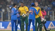 South Africa's Lungi Ngidi (2L) and Corbin Bosch (2R) congratulate India's Shubman Gill and Tilak Varma for their team's win at the end of the fifth Twenty20 international cricket match between India and South Africa at the Narendra Modi Stadium in Ahmedabad on December 19, 2025. (Photo by Shammi Mehra / AFP) 